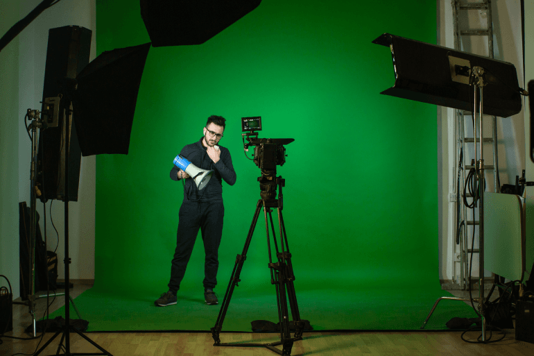 studio-with-camera-lamps-person-with-speaker_1